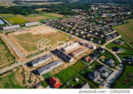 Residential construction site near suburban housing area 126026386