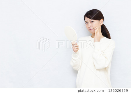 Female suffering from rough skin Female suffering from rough skin 126026559