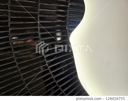 Black Tiles on White Concrete Wall with Beautiful Illuminated Light Background. 126026755