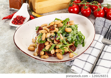 White canned beans with arugula and dry tomatoes White canned beans with arugula and dry tomatoes 126026831