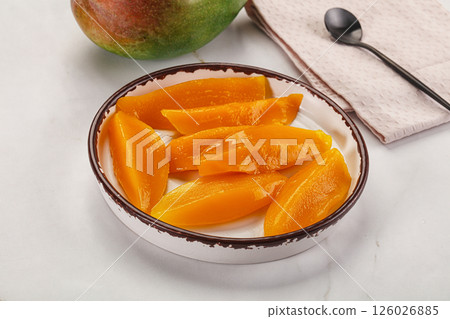 Canned mango slices in the bowl 126026885