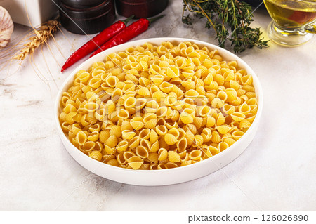Italian cuisine - dry conchiglie pasta Italian cuisine - dry conchiglie pasta 126026890