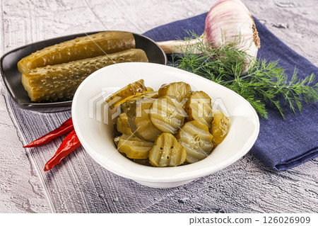 Sliced marinated cucumbers in the bowl 126026909