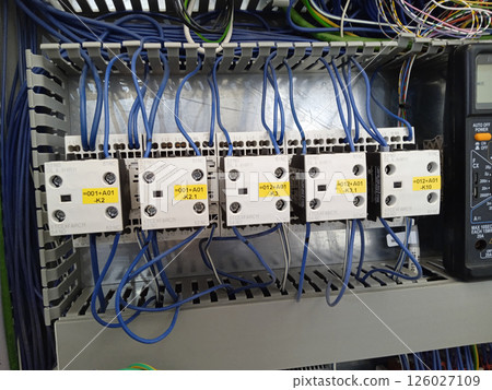 Contactors in the electrical panel. 126027109