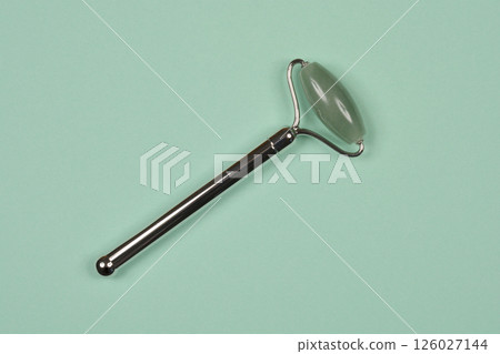 Facial roller with a green stone Facial roller with a green stone 126027144