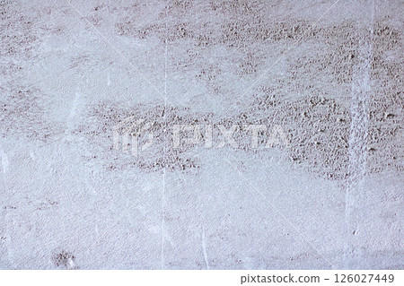 Close up of a concrete wall with many small stones on it 126027449