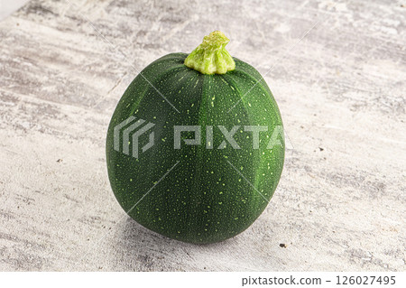 Raw green round zucchini vegetable Raw green round zucchini vegetable 126027495