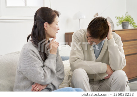 Worried senior couple living room Worried senior couple living room 126028238