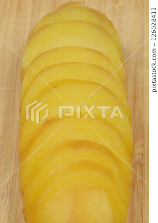 Cooked potato slices Cooked potato slices 126028411