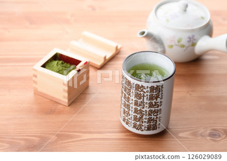Enjoy matcha in a sushi teacup Enjoy matcha in a sushi teacup 126029089