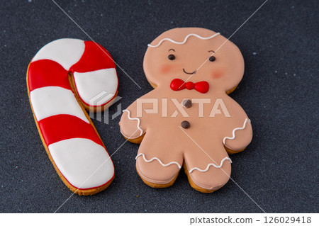 Gingerbread man and cane. Food background. Christmas cookies. Gingerbread man and cane. Food background. Christmas cookies. 126029418