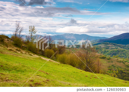 wonderful countryside mountain landscape spring. beautiful outdoor background of carpathian range and valley. distant krasna ridge 126030983