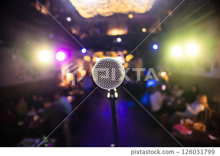 Microphone on stage against a background of auditorium. 126031799