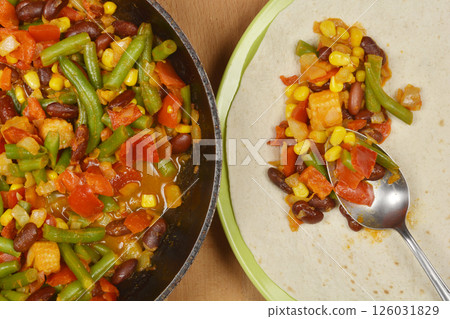 Vegetarian enchilada preparation Vegetarian enchilada preparation 126031829