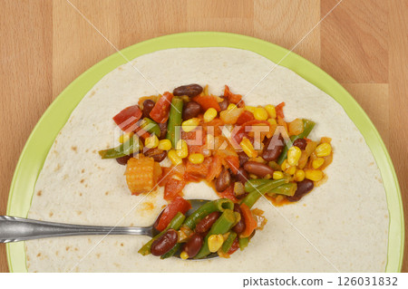 Vegetarian enchilada preparation Vegetarian enchilada preparation 126031832