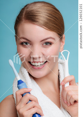 Girl with brush and tongue cleaner. 126032101