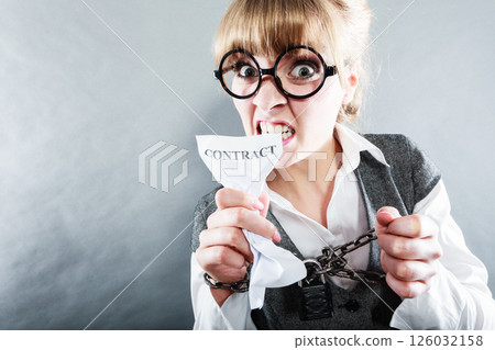 Furious woman with chained hands and contract 126032158