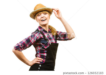 Woman wearing sun hat posing and smiling Woman wearing sun hat posing and smiling 126032183