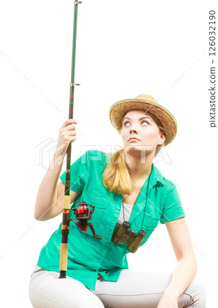 Bored woman with fishing rod, spinning equipment 126032190