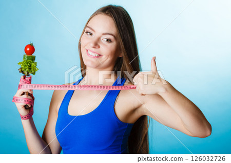 Sporty girl with thumb up sign. 126032726