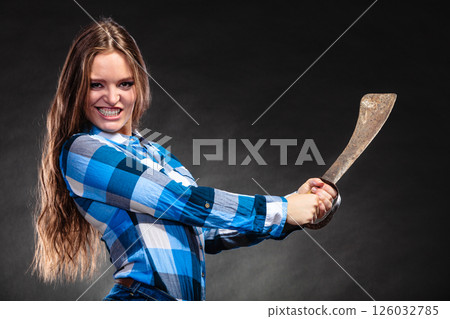 Pretty strong woman holding machete. Pretty strong woman holding machete. 126032785