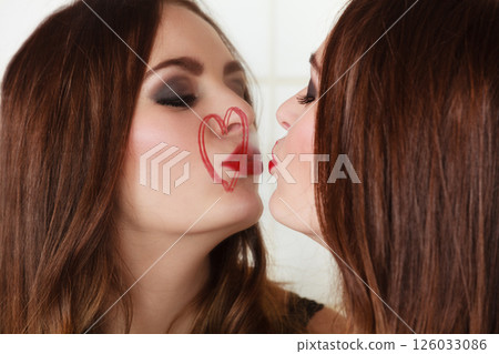 Pretty girl kissing mirror 126033086