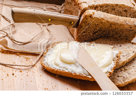 Still life fresh bread with butter and honey 126033357