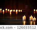 Elegant Wooden Cross with Candles in Soft Glow on a Dark Background for Spiritual Reflection 126033512