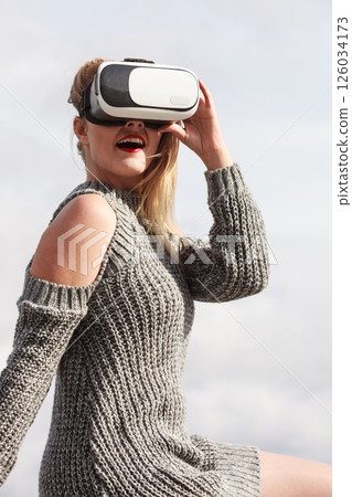Woman wearing VR outside 126034173