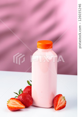 Strawberry milkshake smoothie in eco disposable jar and fresh berries. 126035246
