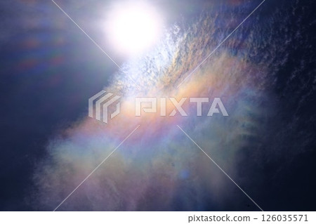 The sun shining in the sky and rainbow clouds 126035571