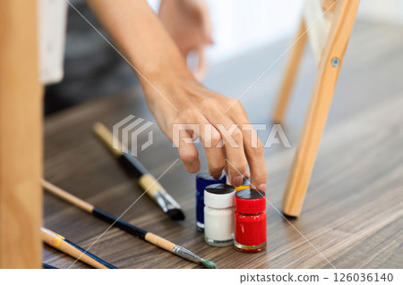 Artistic Expression through Painting: Adult and Child Using Paints Artistic Expression through Painting: Adult and Child Using Paints 126036140