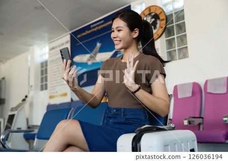 Travel experience at the airport with woman video calling Travel experience at the airport with woman video calling 126036194