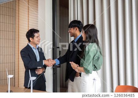 ESG sustainability engagement through teamwork and handshake in office ESG sustainability engagement through teamwork and handshake in office 126036485