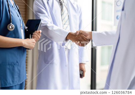 Healthcare Professionals Shaking Hands to Foster Collaboration Healthcare Professionals Shaking Hands to Foster Collaboration 126036784