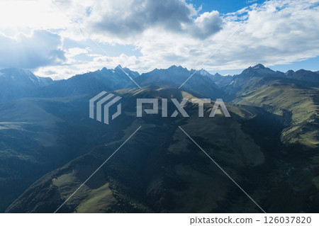 Aerial view of woman trail runner in high altitude mountains 126037820