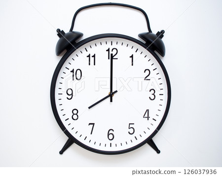 Black Retro Alarm Clock Showing 08:00 or 20:00. Classic Bell Style on White Wood Background. Black Retro Alarm Clock Showing 08:00 or 20:00. Classic Bell Style on White Wood Background. 126037936