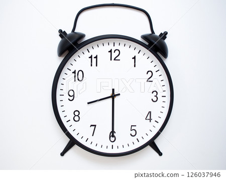 Black Retro Alarm Clock Showing 08:30 or 20:30. Classic Bell Style on White Wood Background. Black Retro Alarm Clock Showing 08:30 or 20:30. Classic Bell Style on White Wood Background. 126037946