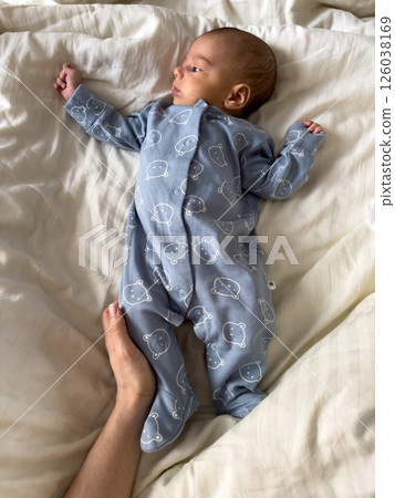 Baby in Blue Onesie with Bear Pattern 126038169