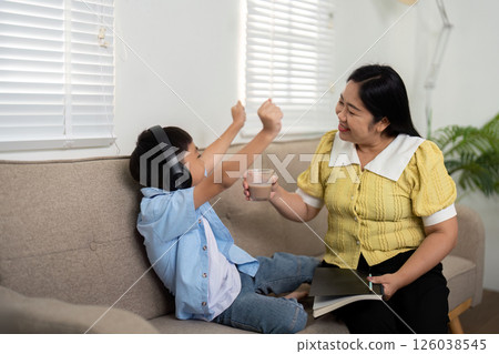 Back to School and Family Bonding. A mother and her son celebrating school preparations with joy and connection. Back to School and Family Bonding. A mother and her son celebrating school preparations with joy and connection. 126038545