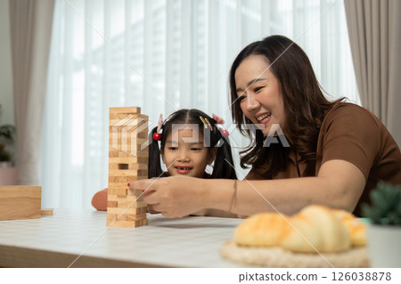 Back to School Creativity and Learning. A mother helps her daughter with art, fostering creativity and educational growth. 126038878