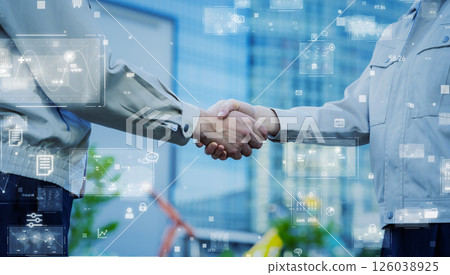 Male and female engineers shaking hands and digital technology concept Male and female engineers shaking hands and digital technology concept 126038925