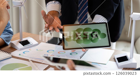 Sustainable ESG meeting featuring data sharing and wind turbine models 126039023