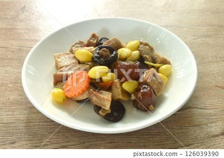 deep fried tofu and gluten with yellow ginkgo and pickled jujube couple black mushroom in soy sauce vegetarian food on plate  126039390