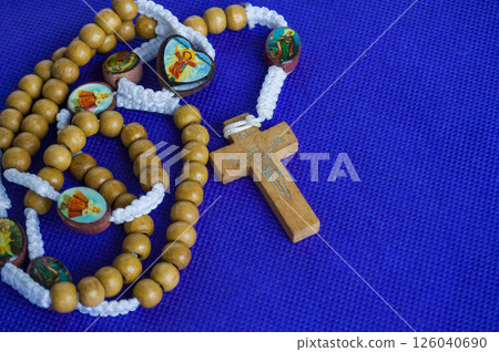 Holy Rosary on purple cloth reminds us of Christ royalty and divine passion. Holy Rosary on purple cloth reminds us of Christ royalty and divine passion. 126040690
