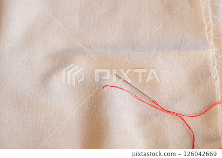 Two strands of red thread 126042669