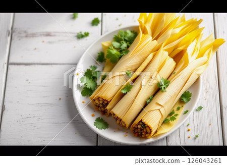Freshly Crafted Tamales Served on a White Plate With Herbs in a Cozy Kitchen. Generative AI 126043261