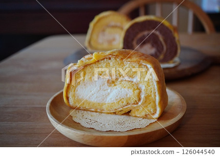 Three different flavors of choux roll cake: honey, chocolate, and plain. 126044540