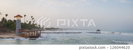 Bayahibe beach at overcast day rough sea and romantic lighthouse 126044620