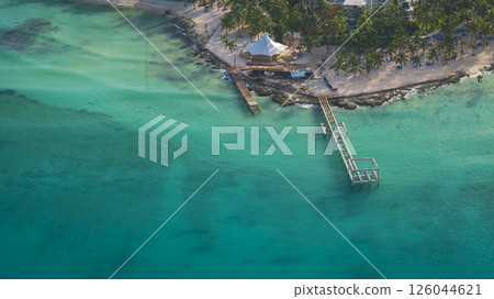 Nice view of turquoise sea and pier at nice sunny day in Dominican republic Nice view of turquoise sea and pier at nice sunny day in Dominican republic 126044621